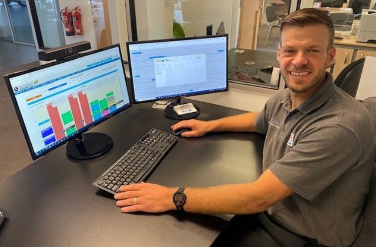 Techman employee working on his device