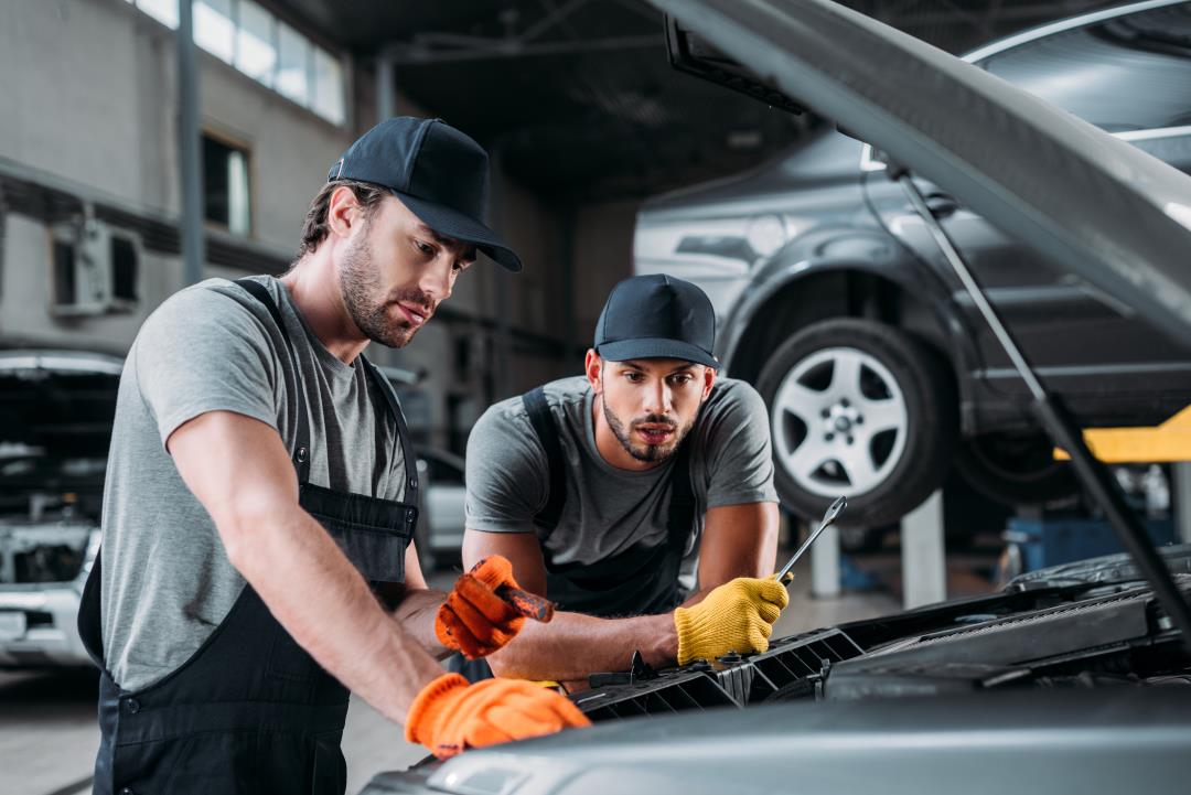 car technicians in a car garage