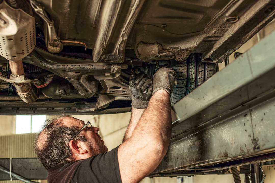 boost customer service, a car technician working on a car