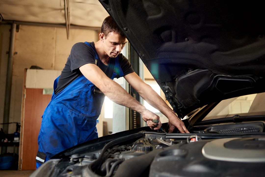 business productivity, a car technician working on a car