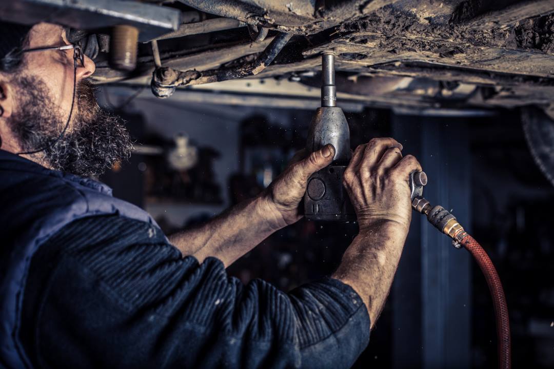 a car technician working on a car