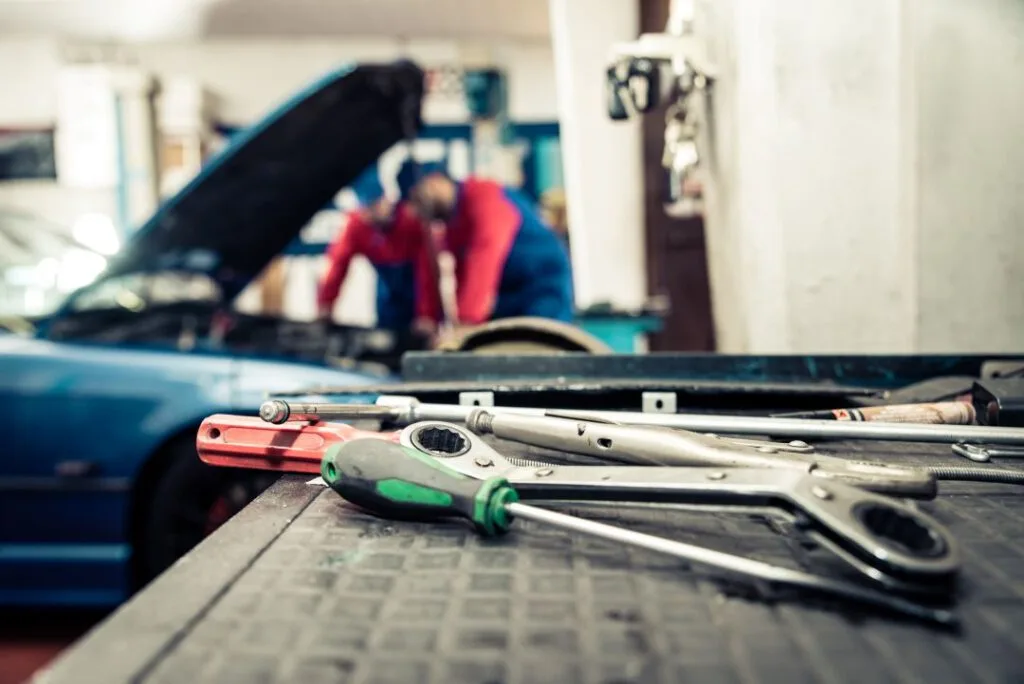 business reports, garage tools laid out on a table