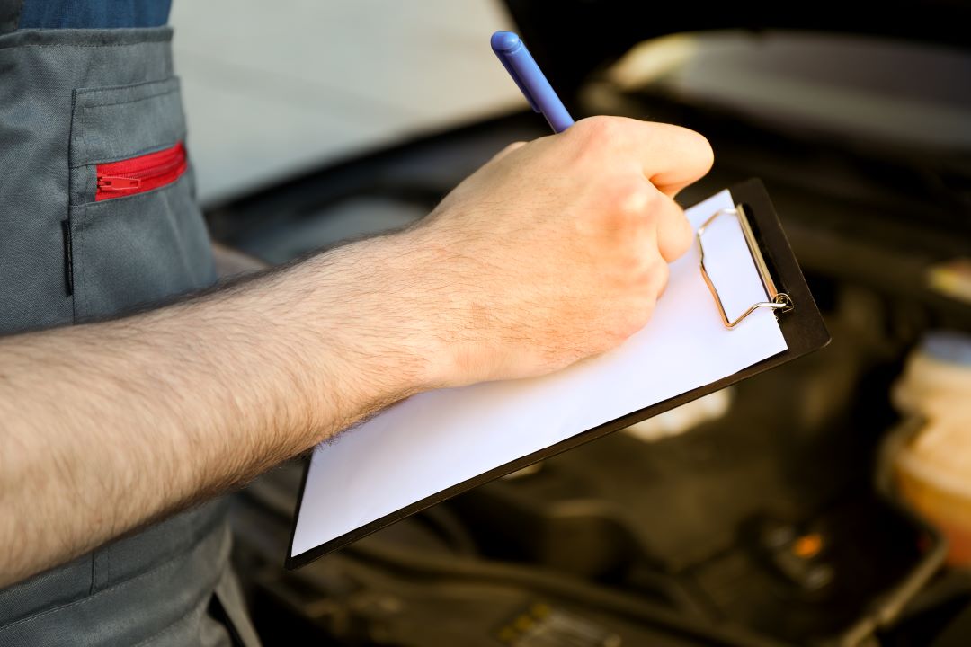 benefits of reporting, a garage manager taking notes