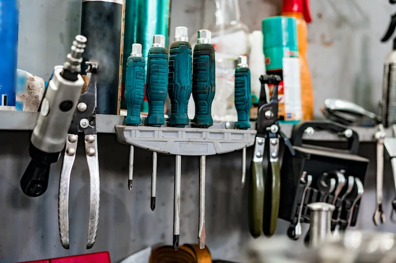 Sustainable garage, car repair tools in a garage.