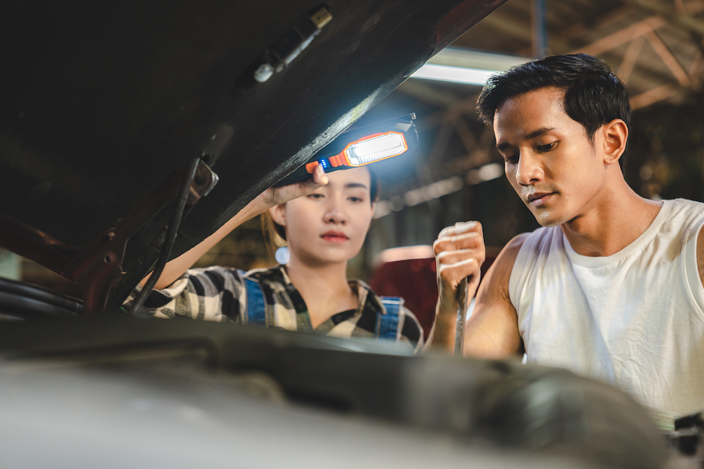garage appointment, man and woman repairing vehicle.