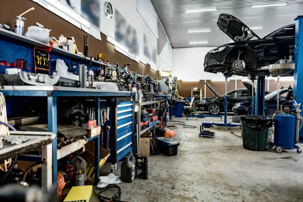 garage upgrade ideas, visual of a garage storage space with cars in the background