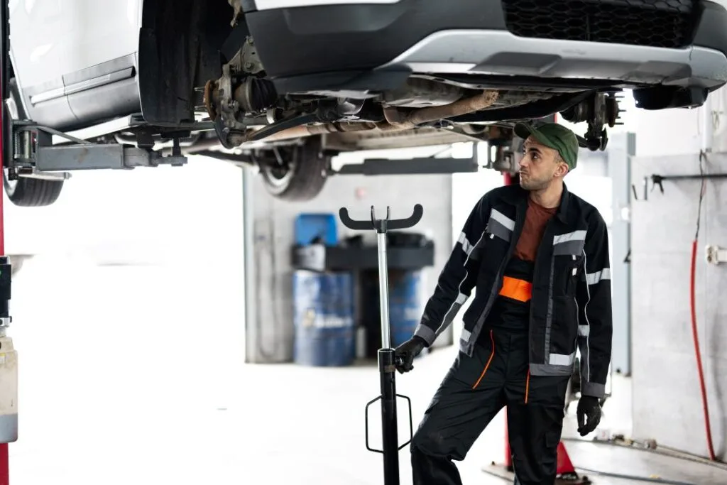 value added services, mechanic working on a car in cold weather